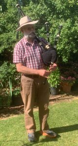 Pastor Darryl Shoesmith playing bagpipes